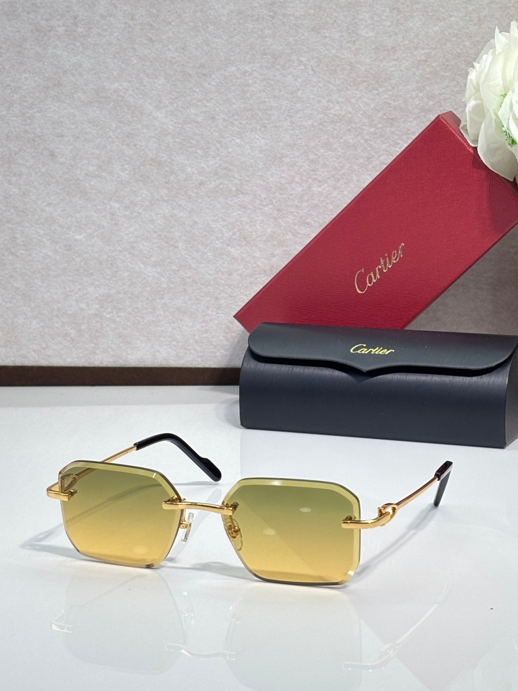 Gold metal-framed eyeglasses with yellow tinted lenses