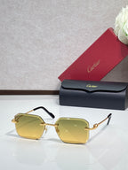 Gold metal-framed eyeglasses with yellow tinted lenses