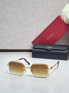 Gold metal-framed eyeglasses with amber tinted lenses