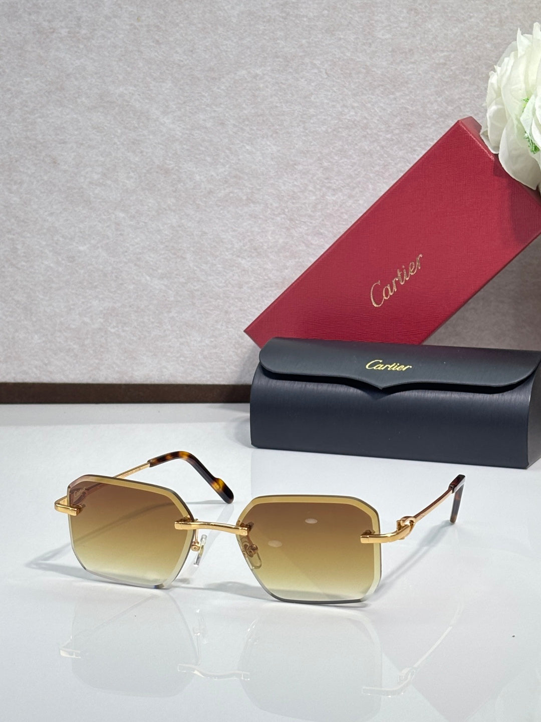 Gold metal-framed eyeglasses with amber tinted lenses