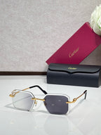Gold metal-framed eyeglasses with dark purple tinted lenses