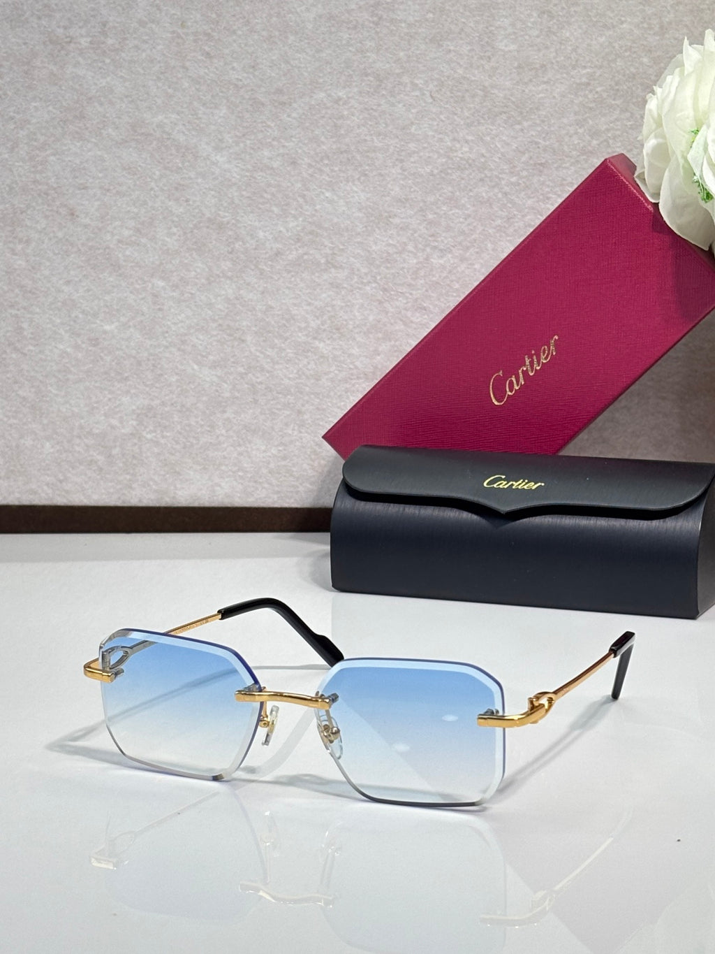 Gold metal-framed eyeglasses with blue tinted lenses
