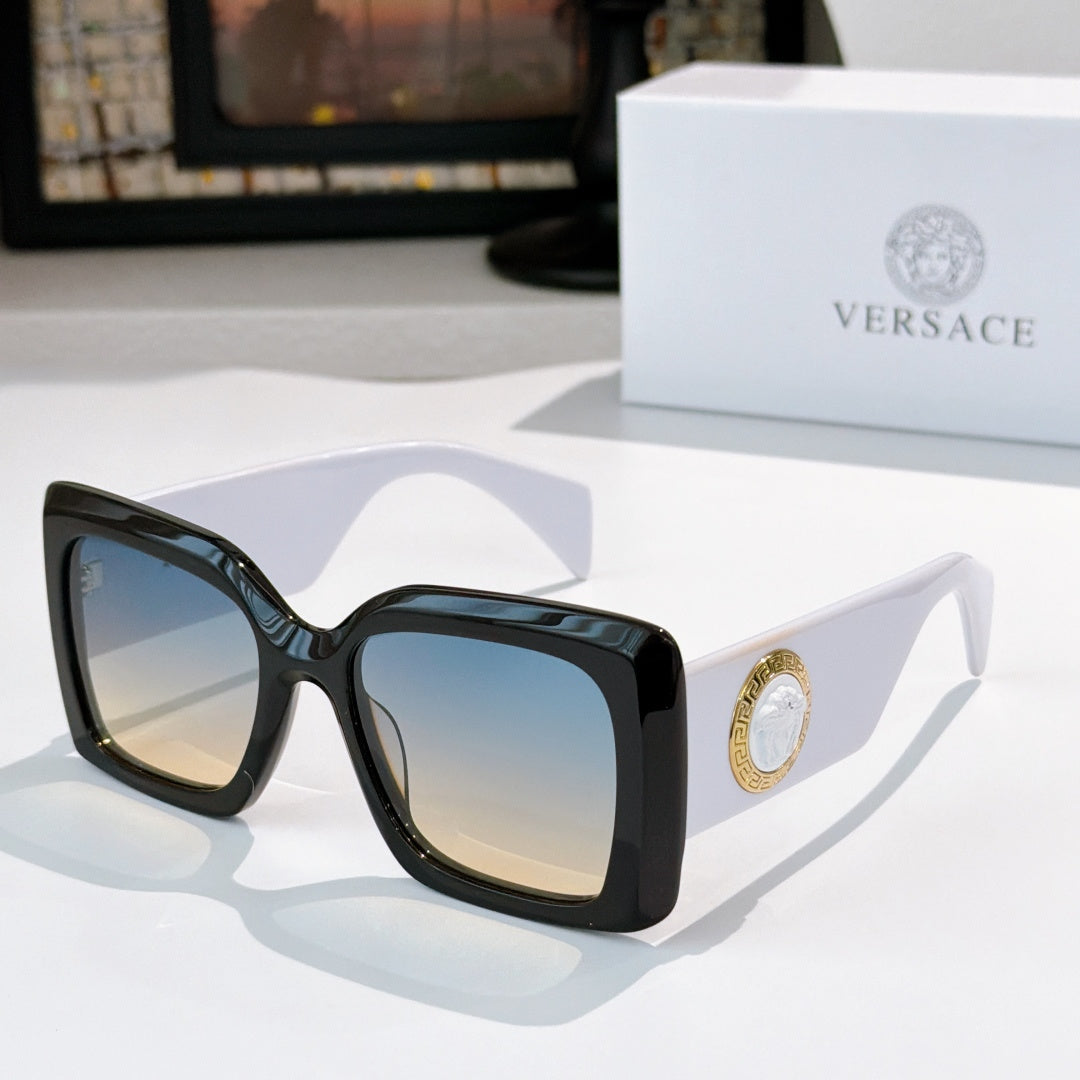 Versace sunglasses with black square frames and light-tinted lenses, gold logo detail