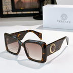 Versace sunglasses with dark tortoiseshell square frames and tinted lenses, gold logo detail