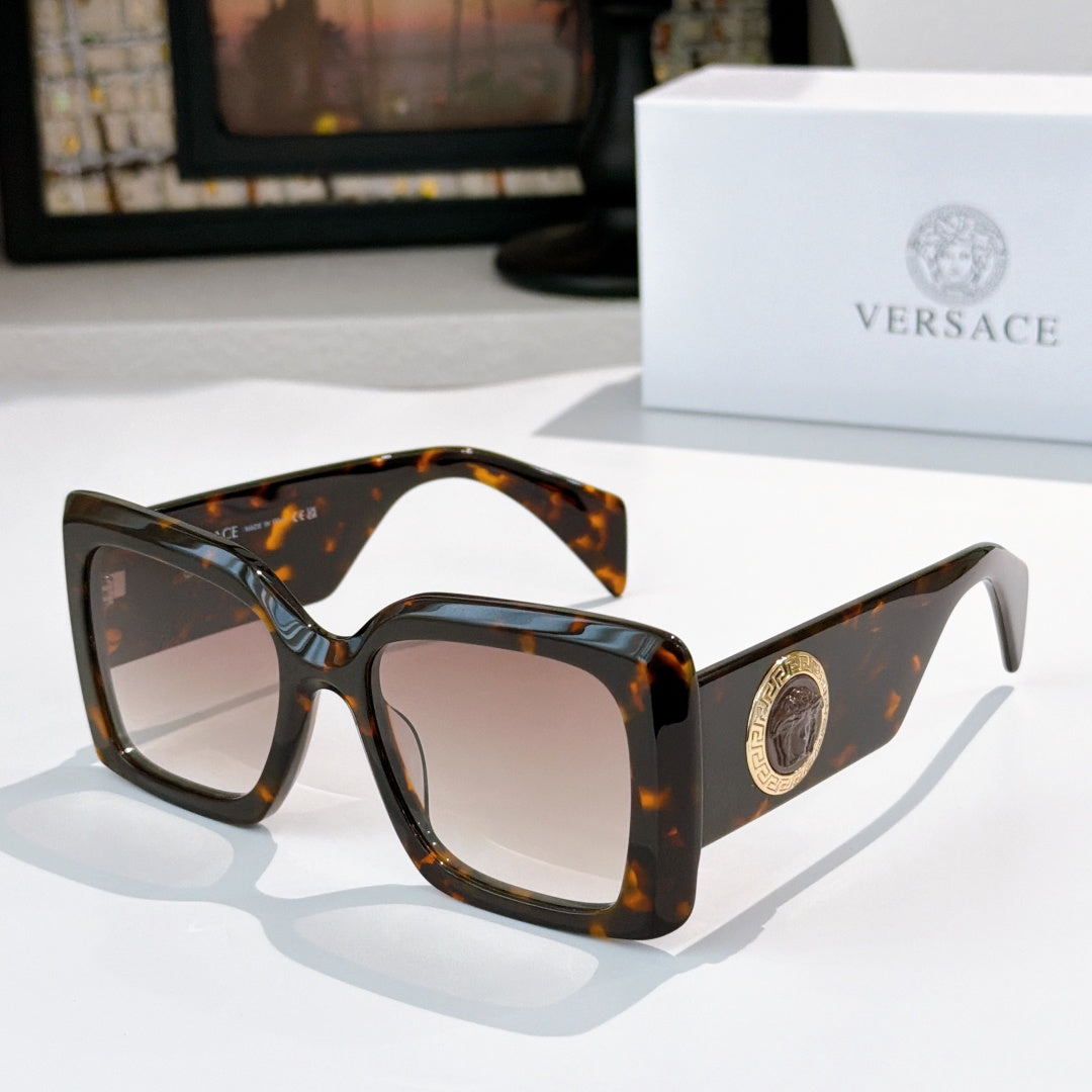 Versace sunglasses with dark tortoiseshell square frames and tinted lenses, gold logo detail
