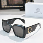 Versace sunglasses with black square frames and tinted lenses, gold logo detail on temple