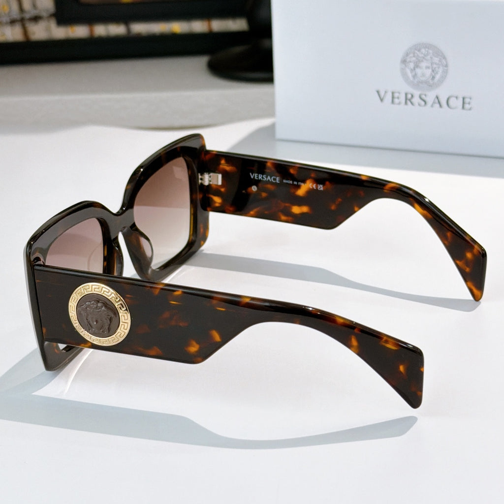 Versace sunglasses side view with tortoiseshell square frame and gold logo temple medallion