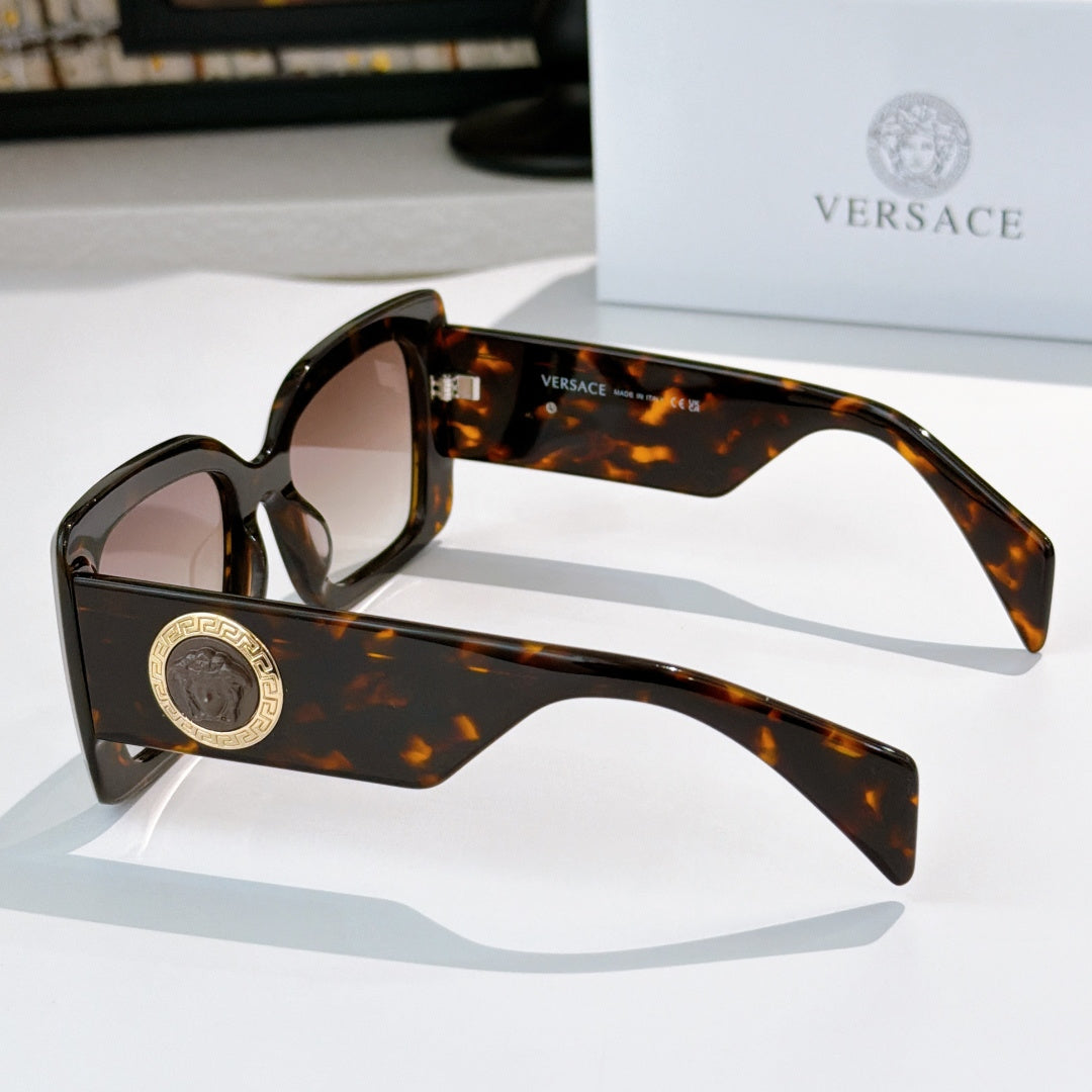 Versace sunglasses side view with tortoiseshell square frame and gold logo temple medallion