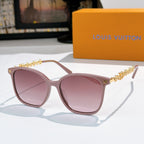 Louis Vuitton sunglasses with mauve frames, gold chain temples, pink tinted lenses