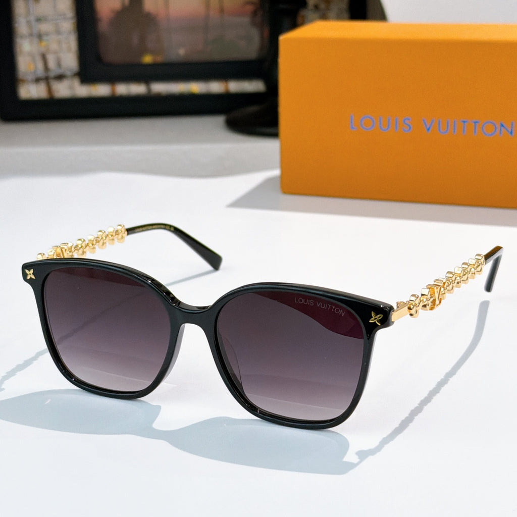 Louis Vuitton sunglasses with black frames, gold chain temples, dark purple tinted lenses
