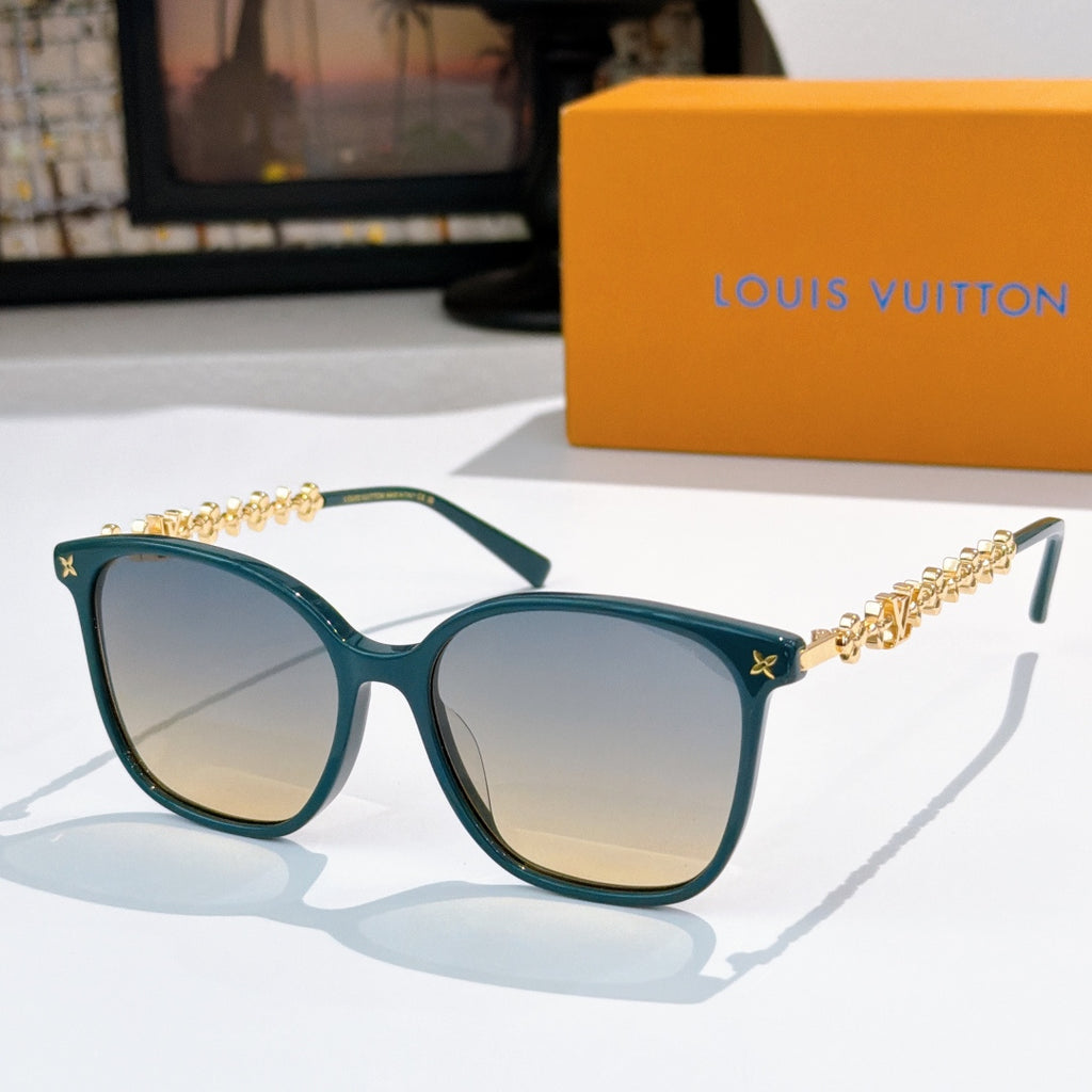 Louis Vuitton sunglasses with teal frames, gold chain temples, yellow tinted lenses