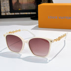 Louis Vuitton sunglasses with white frames, gold chain temples, pink tinted lenses