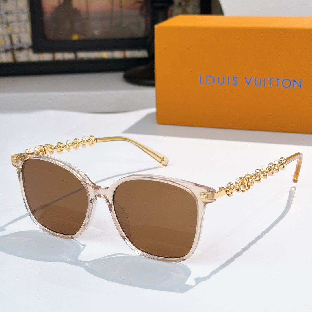 Louis Vuitton sunglasses with light frames, gold chain temples, brown tinted lenses