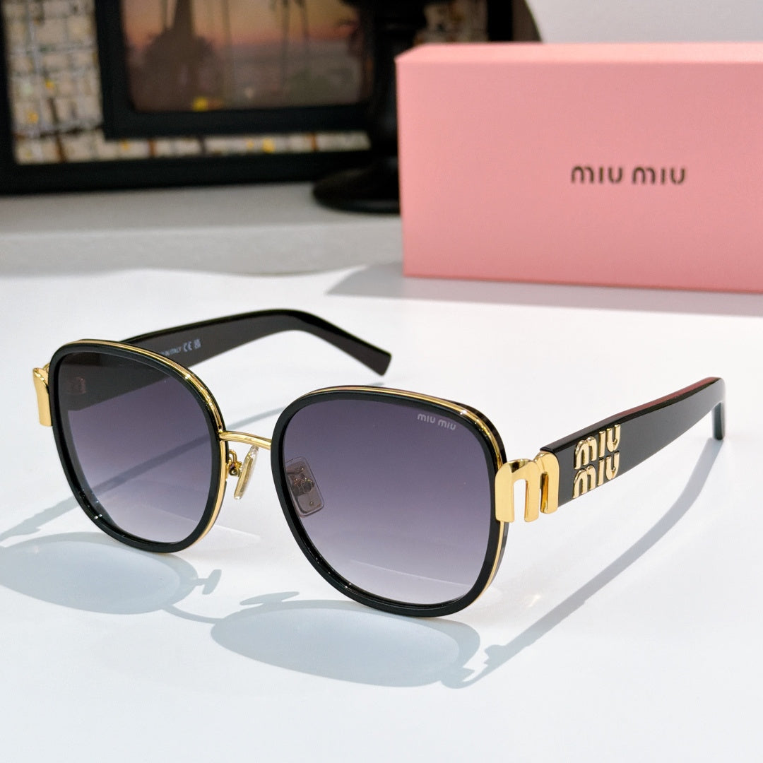 MiuMiu cat-eye sunglasses with black frame and dark purple tinted lenses, gold accents