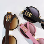 MiuMiu sunglasses assortment with black, brown, and pink frames and tinted lenses, gold hardware