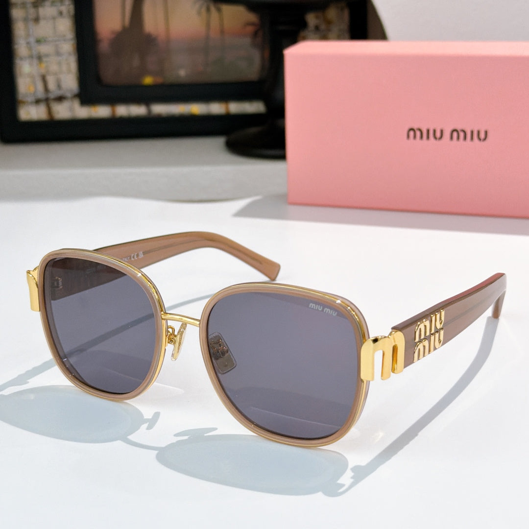 MiuMiu cat-eye sunglasses with light brown frame and blue-gray tinted lenses, gold accents
