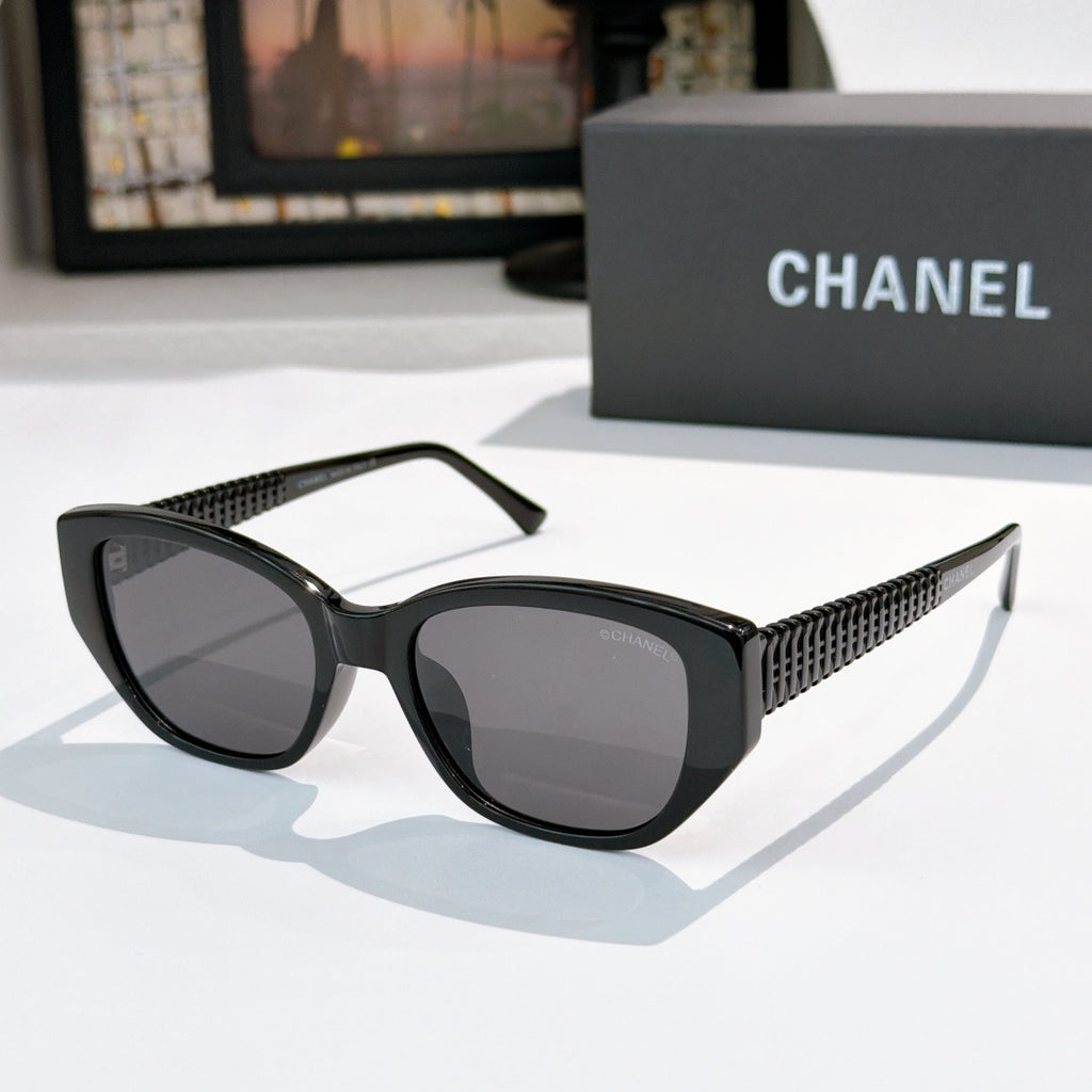 CHANEL black cat-eye sunglasses with dark lenses and textured side arms