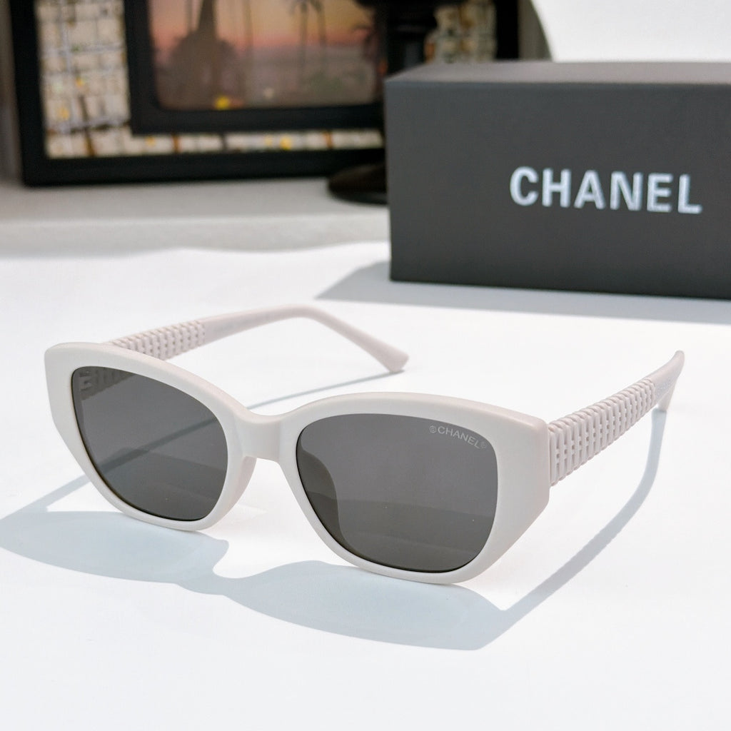 CHANEL white cat-eye sunglasses with dark lenses and textured side arms