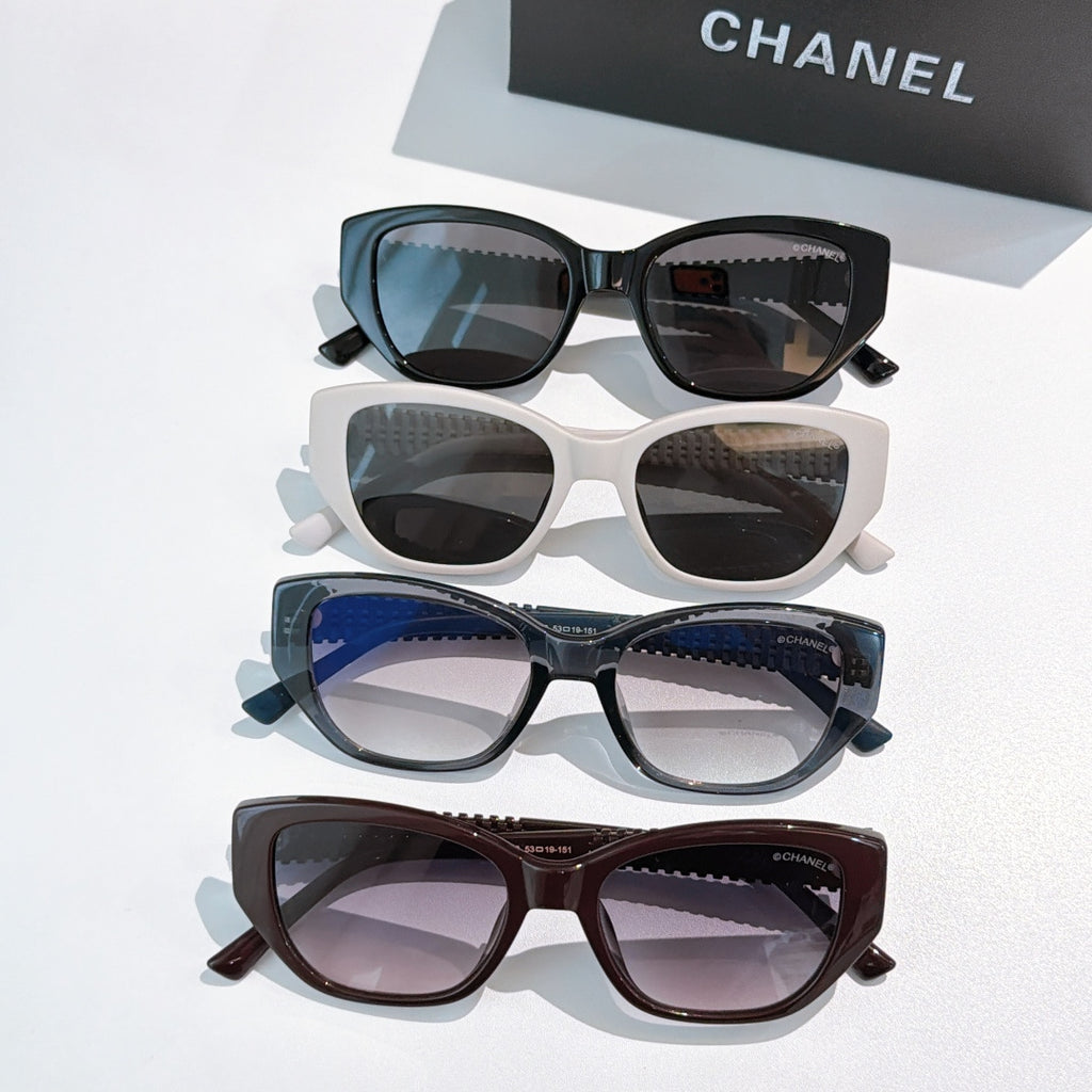 Assorted CHANEL sunglasses: black, white, blue, and brown frames with tinted lenses