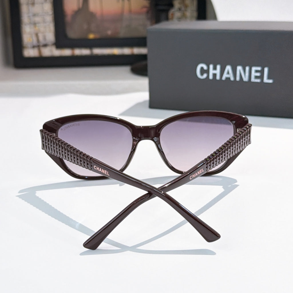 CHANEL dark brown cat-eye sunglasses with purple-tinted lenses and textured temples