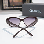 CHANEL dark brown cat-eye sunglasses with purple-tinted lenses and textured temples