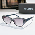CHANEL dark sunglasses with purple-tinted lenses and textured side arms