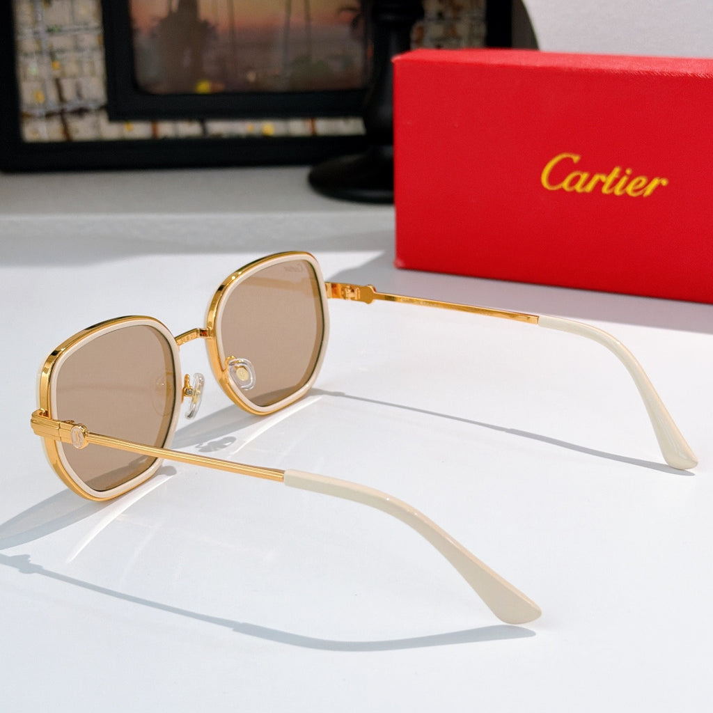 Cartier sunglasses with gold-tone frames and pale lenses, side view