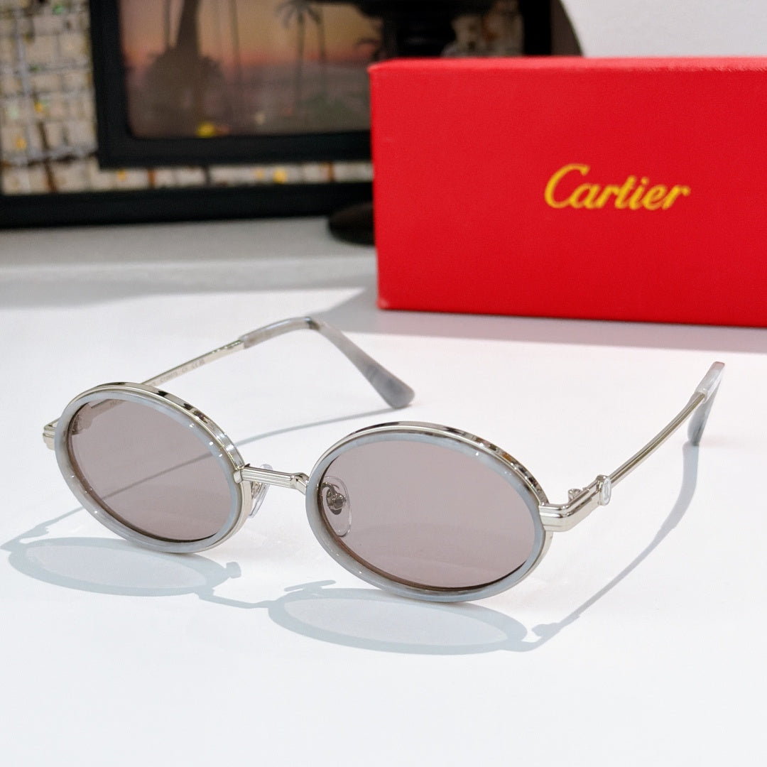 Round sunglasses with silver-tone metal rims and light tinted lenses.