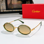 Round sunglasses with green-tinted rims and gold-tone metal, tinted lenses.