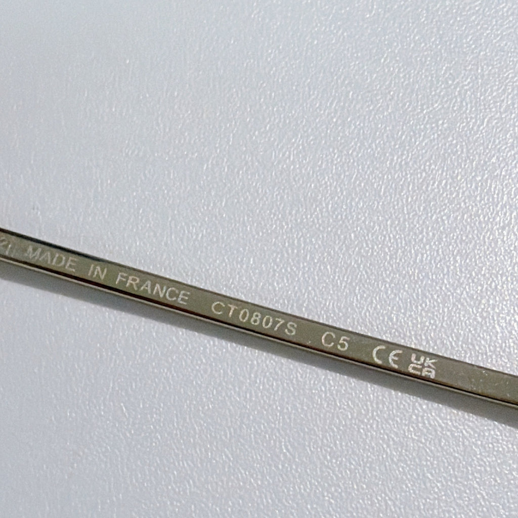 Sunglasses temple engraved with “MADE IN FRANCE” and model code text.
