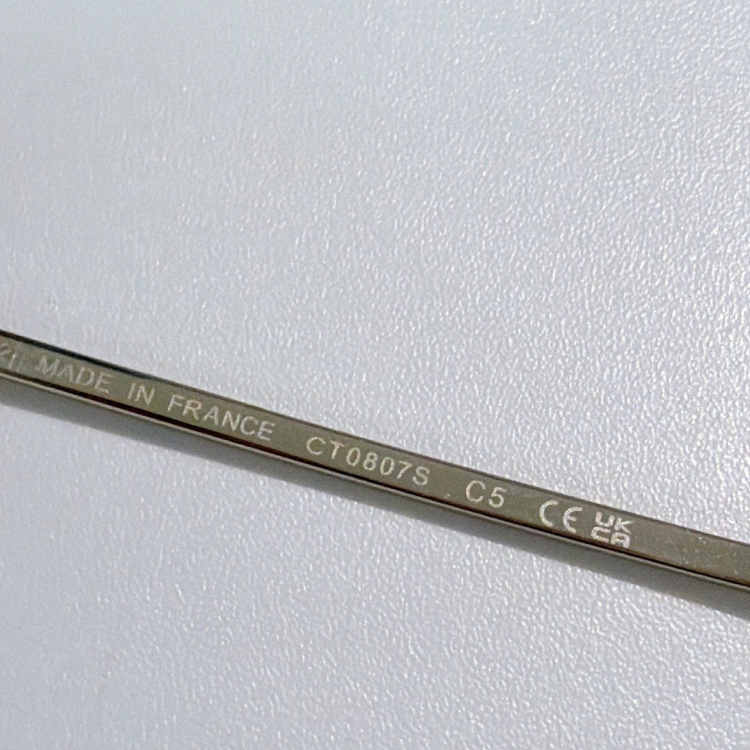 Sunglasses temple engraved with “MADE IN FRANCE” and model code text.