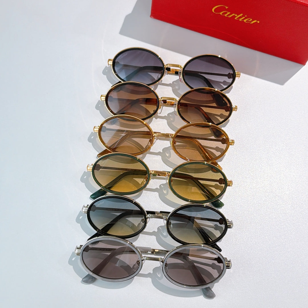 Stack of round sunglasses with mixed metal frames and tinted lenses.