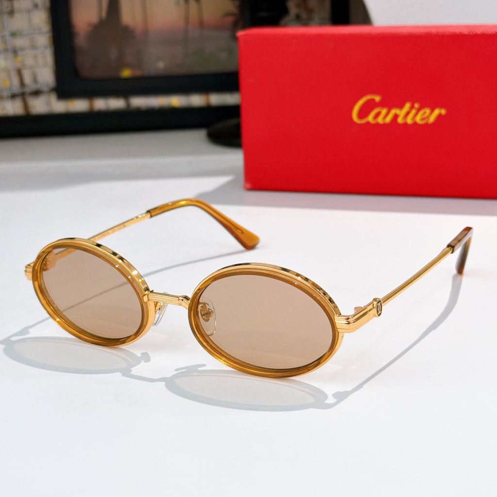 Round sunglasses with clear/gold-tone rims and tinted lenses, gold-tone hinges.