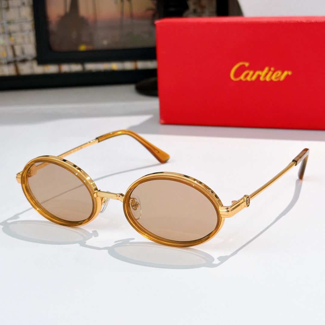 Round sunglasses with clear/gold-tone rims and tinted lenses, gold-tone hinges.