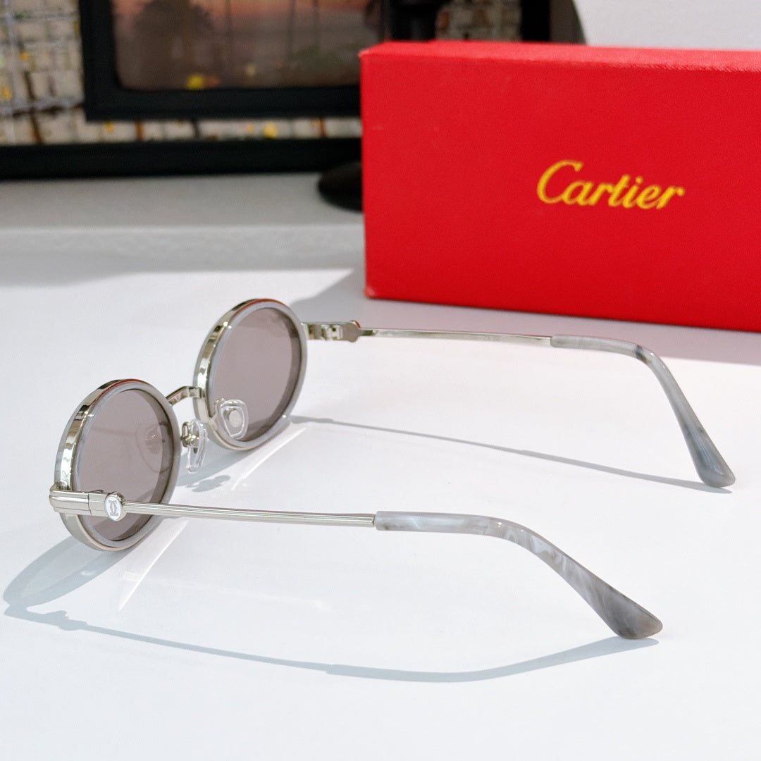 Round sunglasses with silver-tone frames, tinted lenses, and long temples.