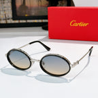 Round sunglasses with dark rims and silver-tone metal, tinted lenses.
