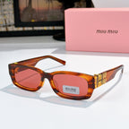 MiuMiu tortoiseshell oversized sunglasses with red-tinted lenses and gold logo temple