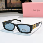 MiuMiu black oversized sunglasses with blue-tinted lenses and gold logo temple detail