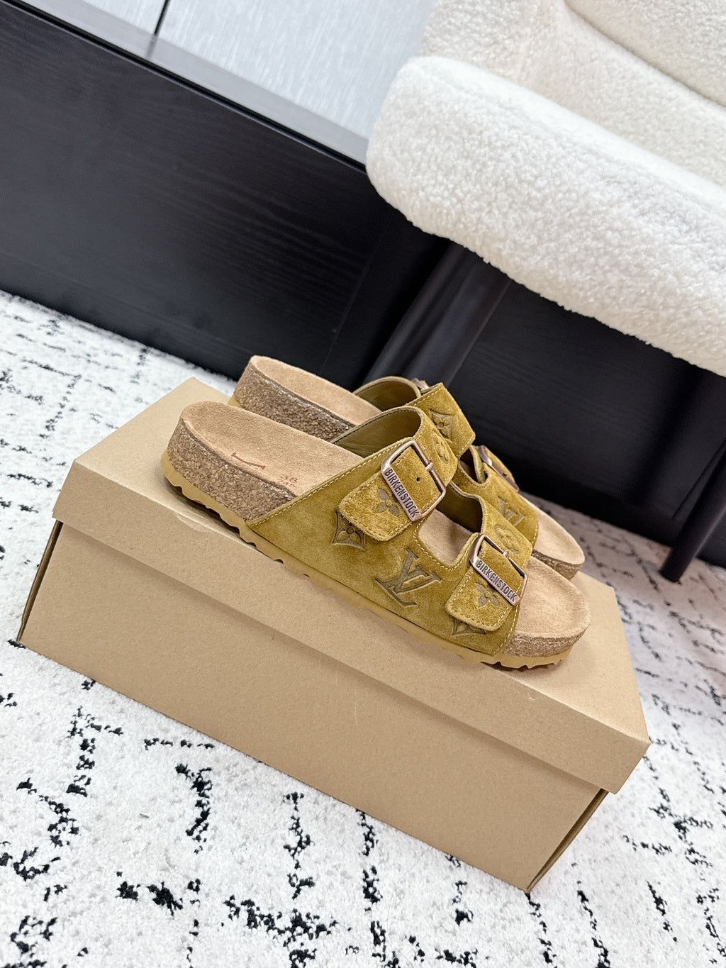 Louis Vuitton mustard sandals with double straps, metal buckles, and suede finish