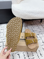 Louis Vuitton mustard sandals with patterned outsole side on shoe box