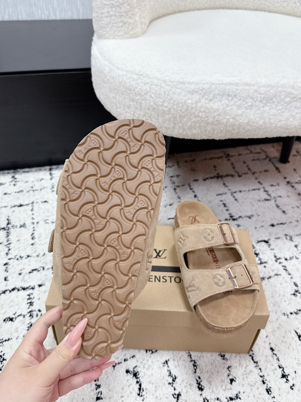 Beige Louis Vuitton slide sandal outsole with molded tread pattern.