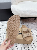 Beige Louis Vuitton slide sandal outsole with molded tread pattern.