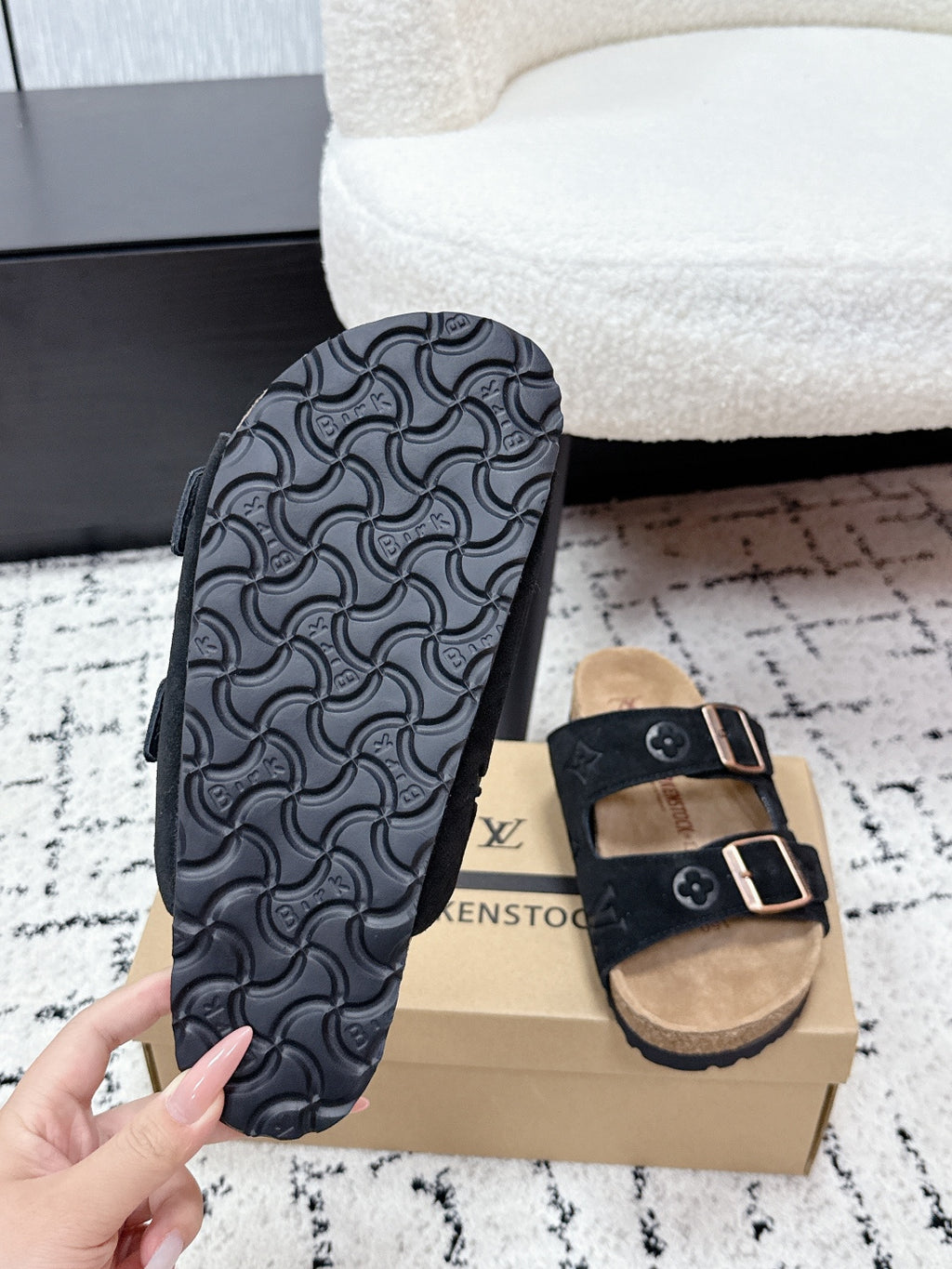 Louis Vuitton slide sandals, tread sole with dark logo pattern and black strap upper