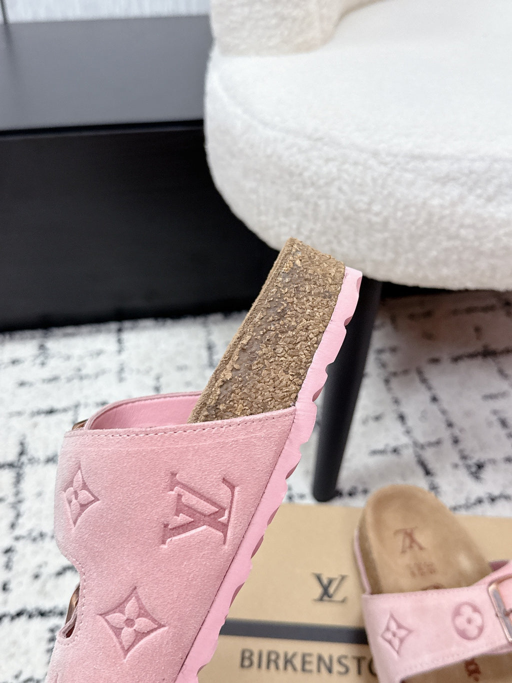 Louis Vuitton pink slip-on sandals with monogram upper and textured sole, angled