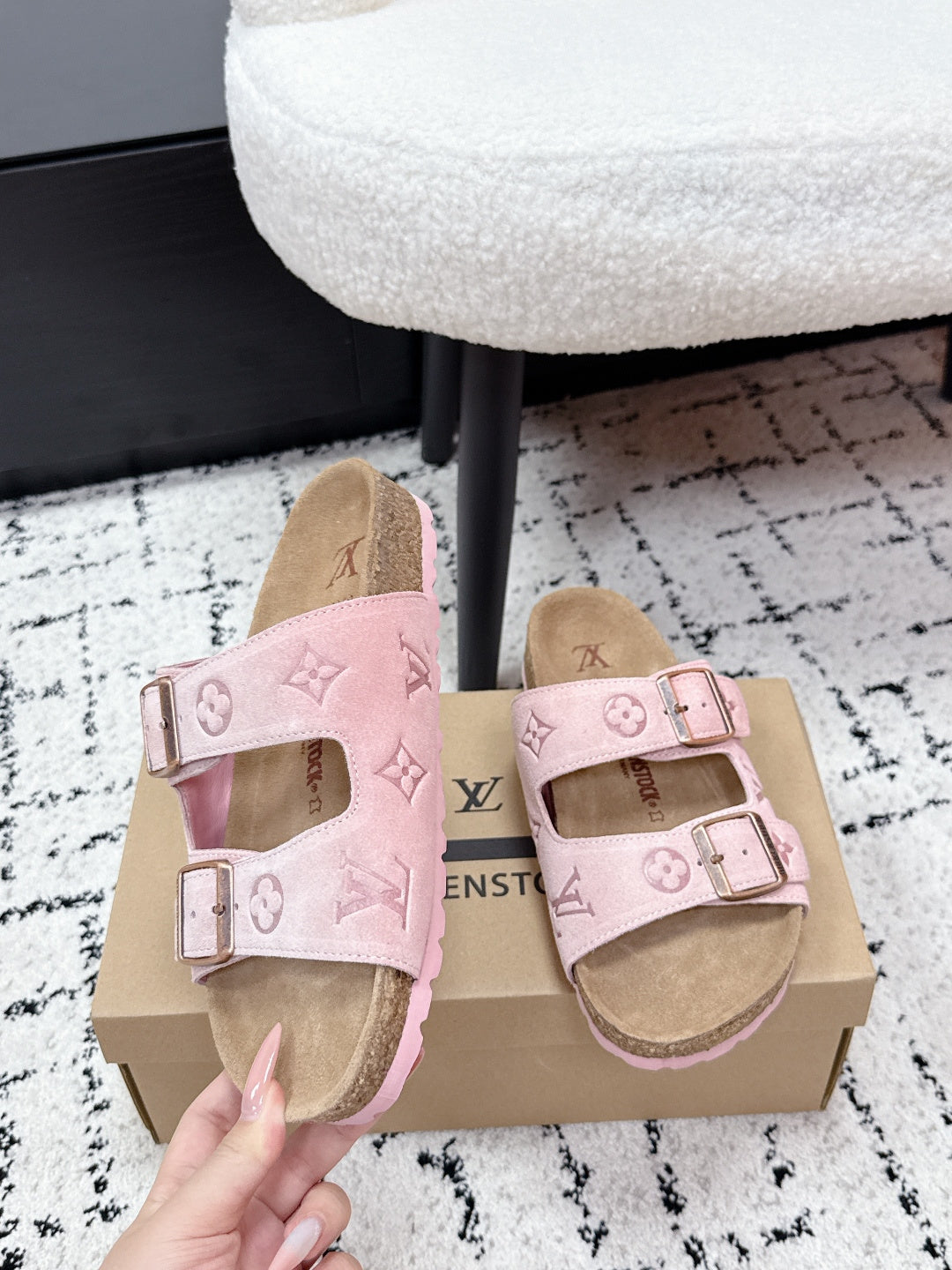 Louis Vuitton pink sandals close-up: double straps with metal buckles, logo pattern