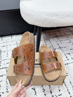 Tan Louis Vuitton monogram slide sandals, front view with two buckle straps