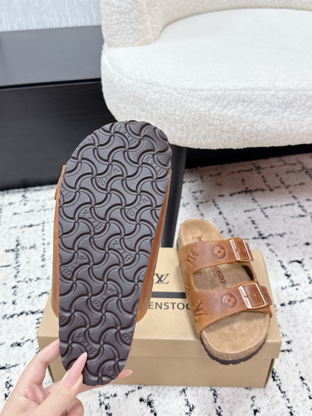 Black Louis Vuitton slide sandal outsole with textured geometric tread