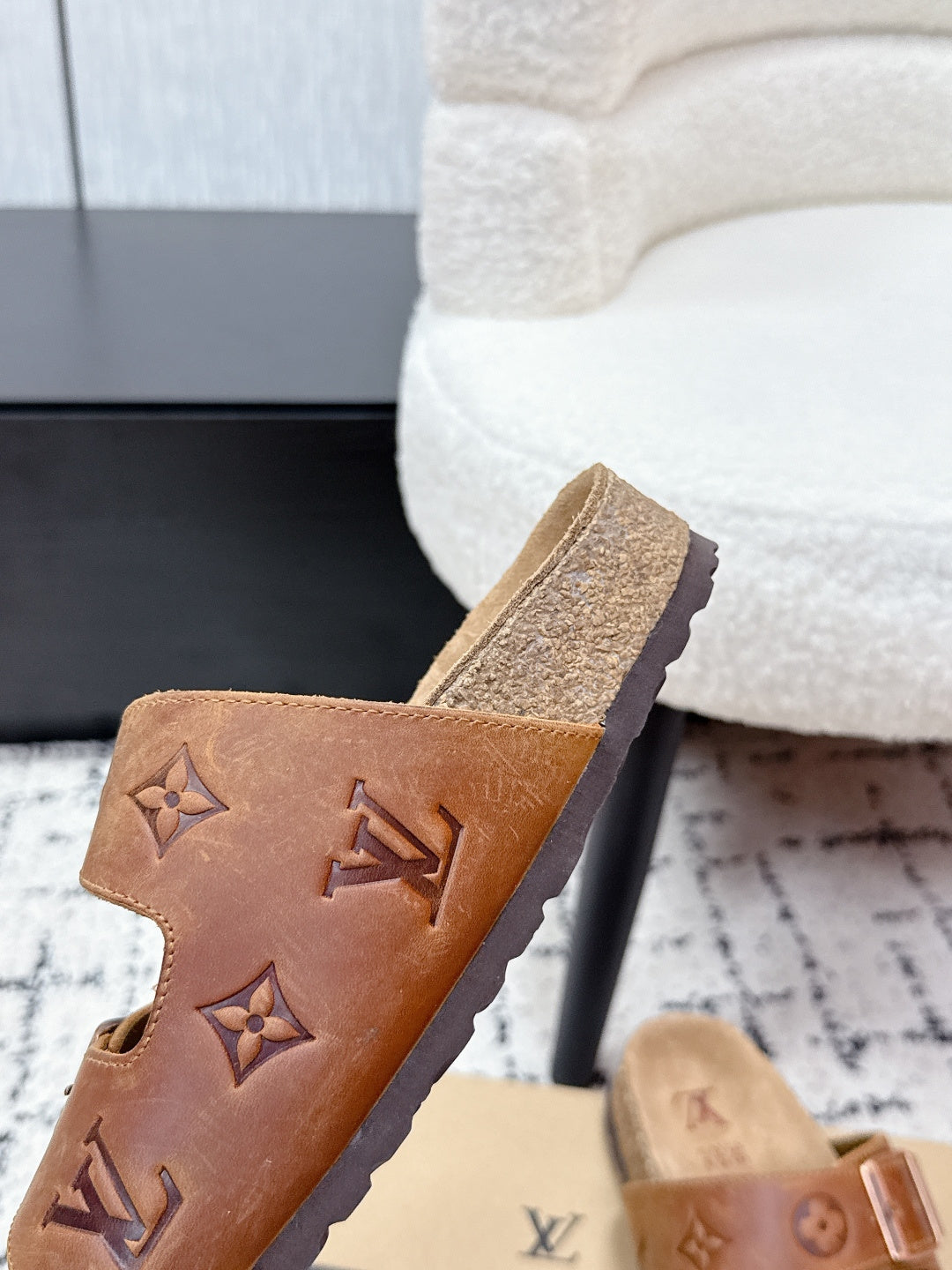 Tan Louis Vuitton monogram slide sandal close-up strap with buckle