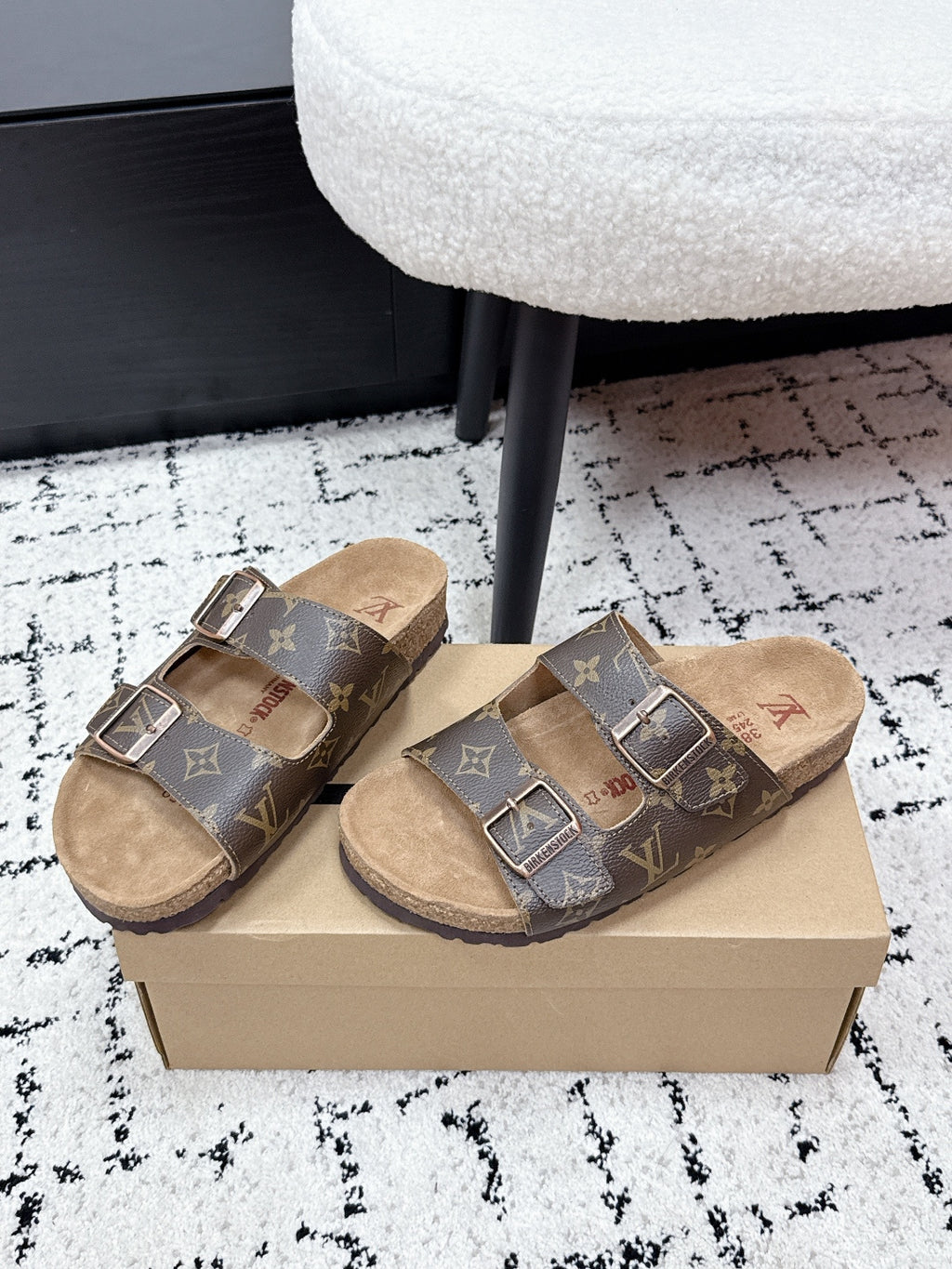 Louis Vuitton monogram slide sandals with two metal buckle straps, tan lining.