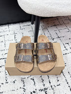Louis Vuitton monogram slide sandals with two buckles, tan footbed.